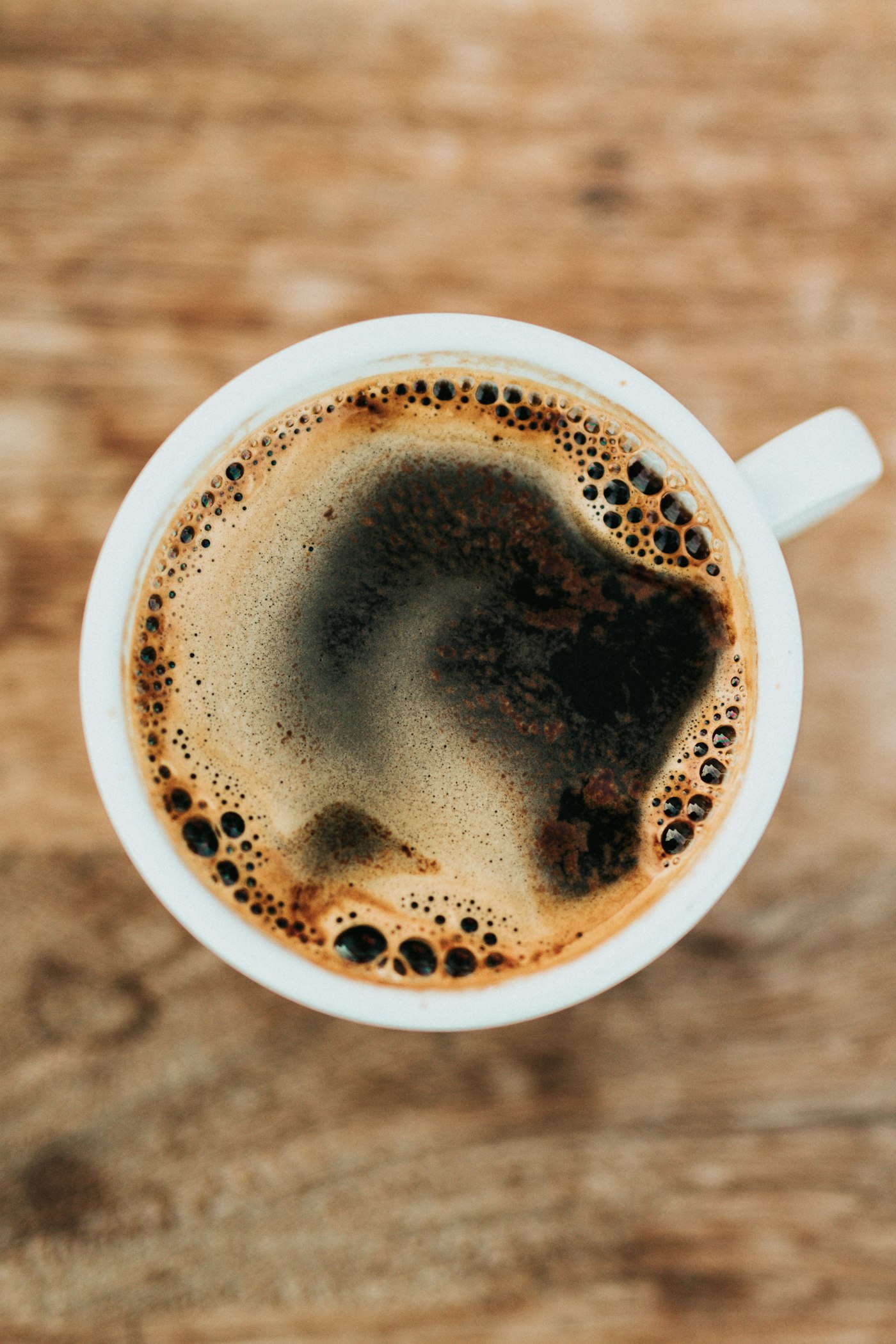 Fresh cup of premium coffee with rich crema